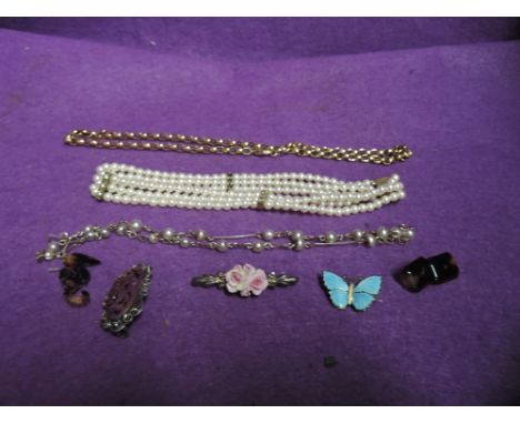 A small selection of costume jewellery including a yellow metal belcher chain, tortoise shell style cufflink and brooch, silv