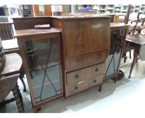 An Edwardian mahogany display bureau cabinet, having inlay decoration with breakfront fall flap and drawers under, flanked by