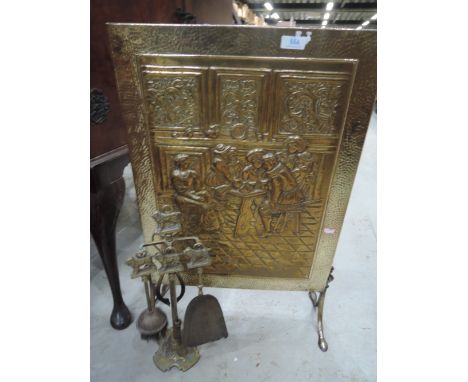 A brass firescreen and tools