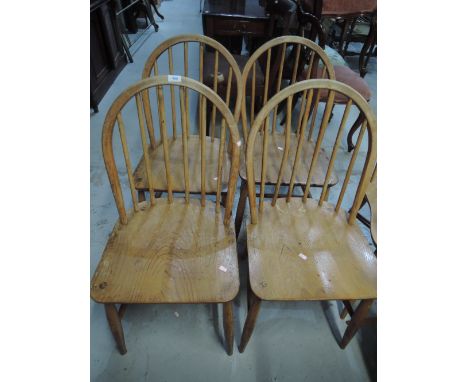 A set of four Ercol style hoop and stick back chairs