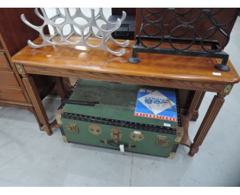 A reproduction console table in the classical style