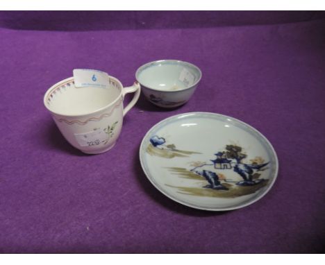 An early hand painted tea cup and similar Chinese export tea bowl and saucer hand decorated 