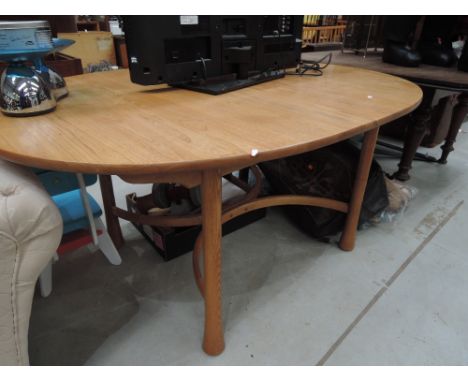 A modern golden oak Ercol dining table