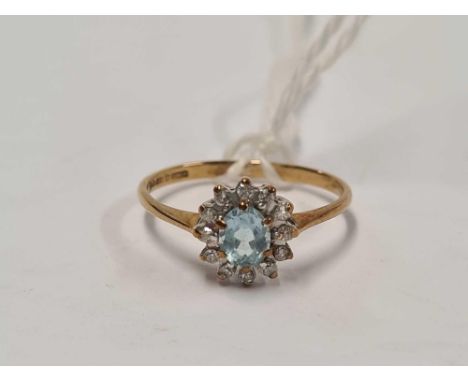 A AQUAMARINE &amp; DIAMOND OVAL CLUSTER RING SET IN 9ct, SIZE 'K'