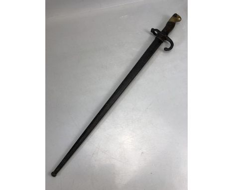 Military French bayonet in scabbard inscribed St Etienne June 1877