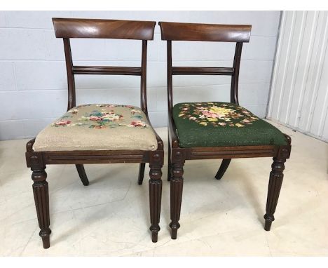 Pair of mahogany chairs with turned front legs and tapestry seats