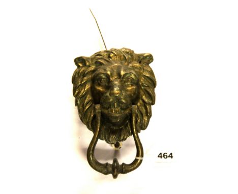 A Victorian brass lion head door knocker, H. 21cm.
