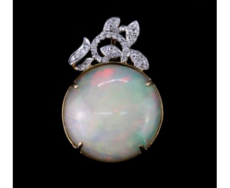 A 14ct yellow gold (stamped 585) pendant set with a 19ct cabochon cut opal and diamonds, L. 3.5cm.