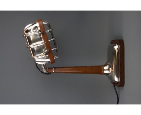 An interesting metal and leather desk lamp, H. 42cm.