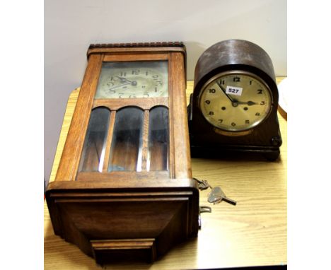 An oak wall clock and an oak mantle clock.