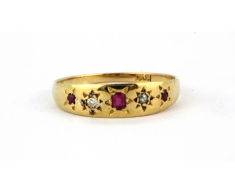 An 18ct yellow gold (stamped 18ct) ruby and diamond set ring, (R).