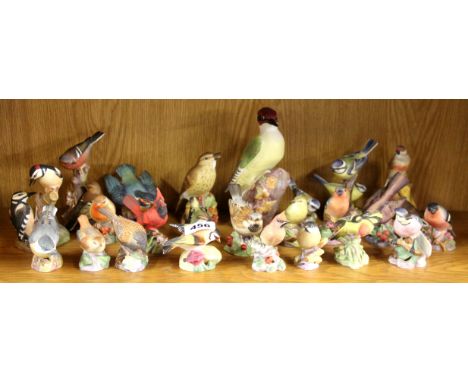 A collection of 24 Royal Worcester porcelain bird figures by F. Doughty c. 1970's.
