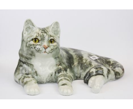 A large Winstanley ceramic figure of cat with glass eyes, W. 36cm.