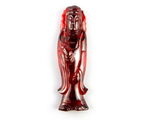 A rare Chinese carved ruby stone figure of the Goddess Guanyin, H. 13cm W. 332g.