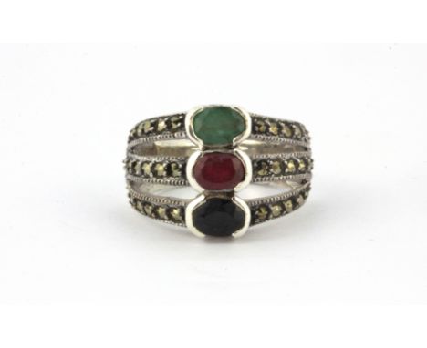 A 925 silver and marcasite ring set with sapphire, ruby and emerald, (L).