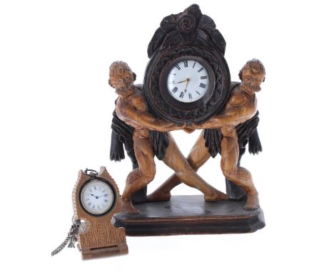 Carved wooden pocket watch stand, 10'' high with silver fusee verge pair cased pocket watch, the movement with pierced engrav