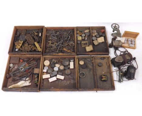 Old wooden watchmakers cabinet enclosing seven drawers containing a quantity of tools, clock accessories and watch and clock 