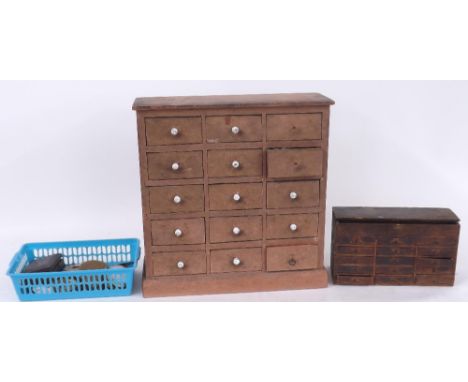 Wooden fifteen drawer wooden chest containing a quantity of watch and clock parts to include hands, mainsprings, balances, ba