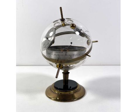 A combined Aneroid Barometer, Hygrometer, Thermometer in a spherical perspex/plastic 'mine' on a stand. Approx 23cm tall. Pre