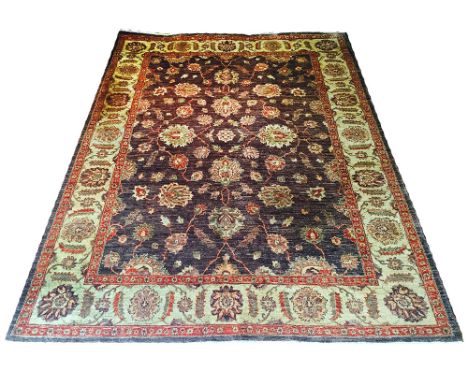 ZIEGLER FEREGHAN CARPET, 302cm x 223cm, all over palmette and vine design on a chocolate field within corresponding bands and