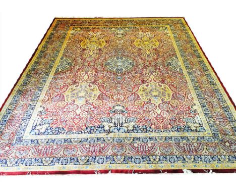 FINE PERSIAN KERMAN LAVER DESIGN CARPET, 365cm x 280cm, central medallion on an intricate field of flowerheads and scrolling 