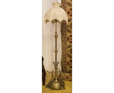 BRASS STANDARD LAMP, late Victorian with adjustable action ornate base, plus shade. 