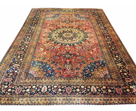 ANTIQUE MASHAD CARPET, 452cm x 315cm, central boteh bordered medallion on a terracotta field of palmettes and vines within co