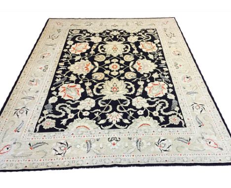 FINE FEREGHAN DESIGN CARPET, 293cm x 243cm, all over palmette and vine design on a noir field within corresponding bands and 