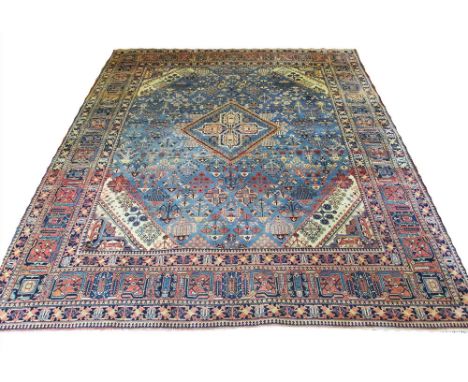 ANTIQUE JOSHAGAN CARPET, 300cm x 234cm, diamond medallion on a powder blue field of scattered amulettes within multiple corre