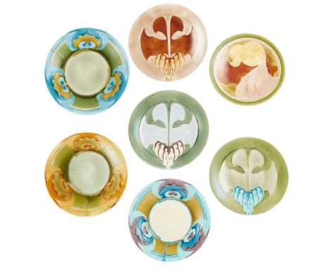 MINTONS LTD. SEVEN ‘SECESSIONIST WARE’ PLATES, CIRCA 1904 tube lined and glazed earhenware, each plate impressed 'MINTONS', m