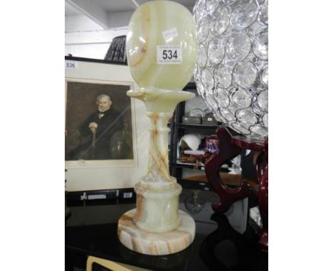 An onyx table lamp.
