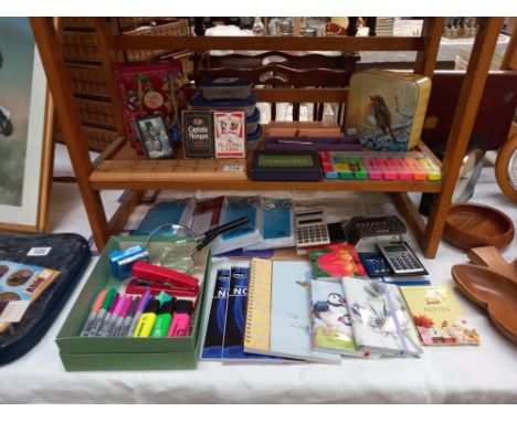 A quantity of games and home office items, cribbage board, dominoes, plus note books, envelopes, highlighters etc