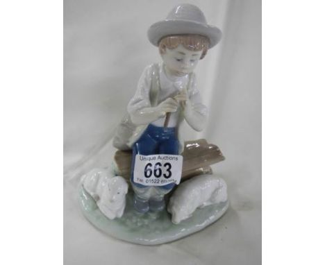 A NAO figure by Lladro of a boy.