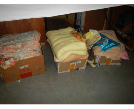 Three boxes of assorted curtains, blankets, bed linen etc.,
