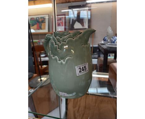 A green glazed Clarice Cliff jug