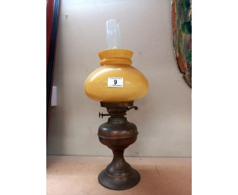 A vintage brass oil lamp