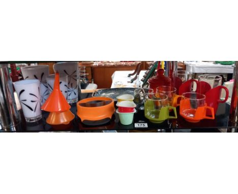 A shelf of retro/vintage plastic &amp; glass cups &amp; other items