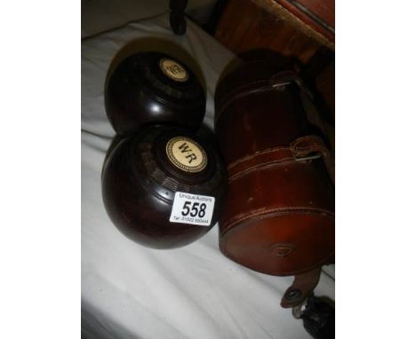 A pair of lawn bowls marked W R.