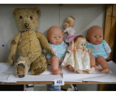 A quantity of vintage dolls and an old teddy bear, a/f.