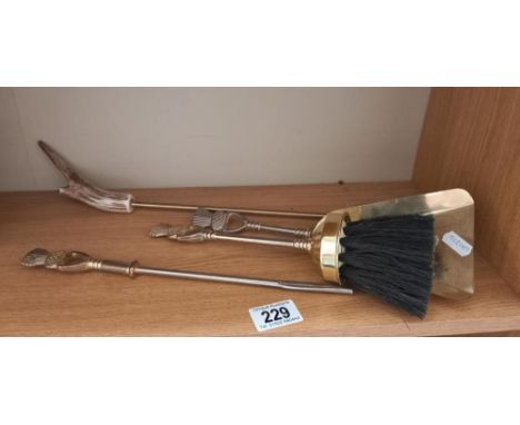 A quantity of fire irons with thistle decoration and a toasting fork with antler