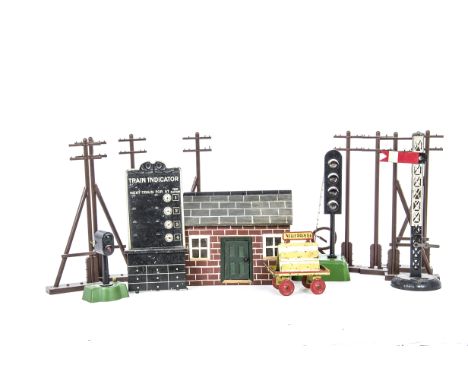 A Group of Lineside Accessories for O Gauge or Larger by Various Makers, comprising an early Kibri 'Newspapers' platform trol