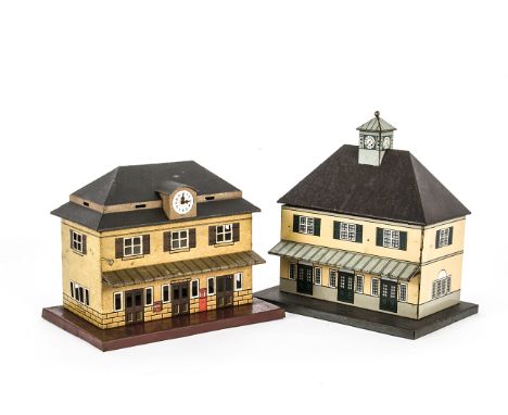 Two Bub O Gauge Stations, one without trademark in buff with dark green doors and shutters, low grey platform, 'grained' brow