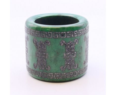 A jade archer's ring.  3 cm high. 