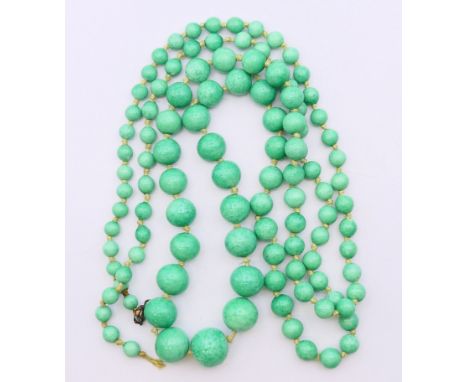 A jade bead necklace.  104 cm long. 