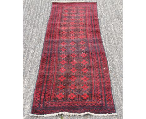 A Bokhara wool runner.  71 cm x 235 cm. 