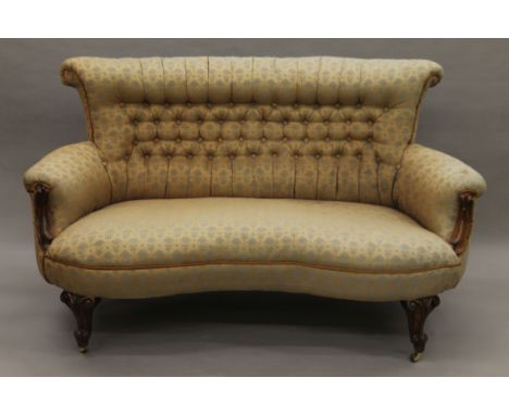 A Victorian button-upholstered mahogany settee. 145 cm long.