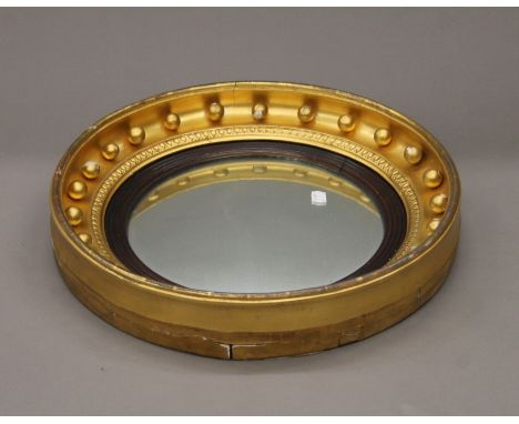 A Victorian gilt framed convex wall glass/mirror. 45 cm diameter.