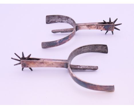 A pair of vintage spurs.  11 cm wide. 