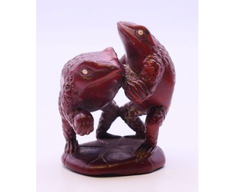 A netsuke in the form of two frogs. 5.5 cm high.
