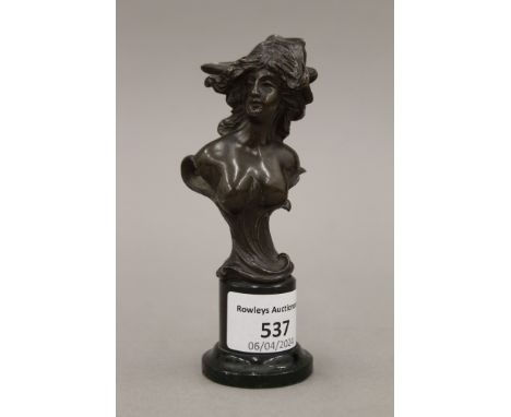 A small French Art Nouveau bronze nude bust of a female, on a hardstone base. 12.5 cm high. 